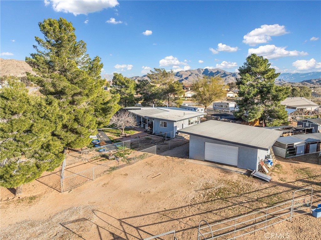 22977 El Centro Road Apple Valley, CA 92307 - Photo 2 of 30 a view of a house with a yard and sitting area