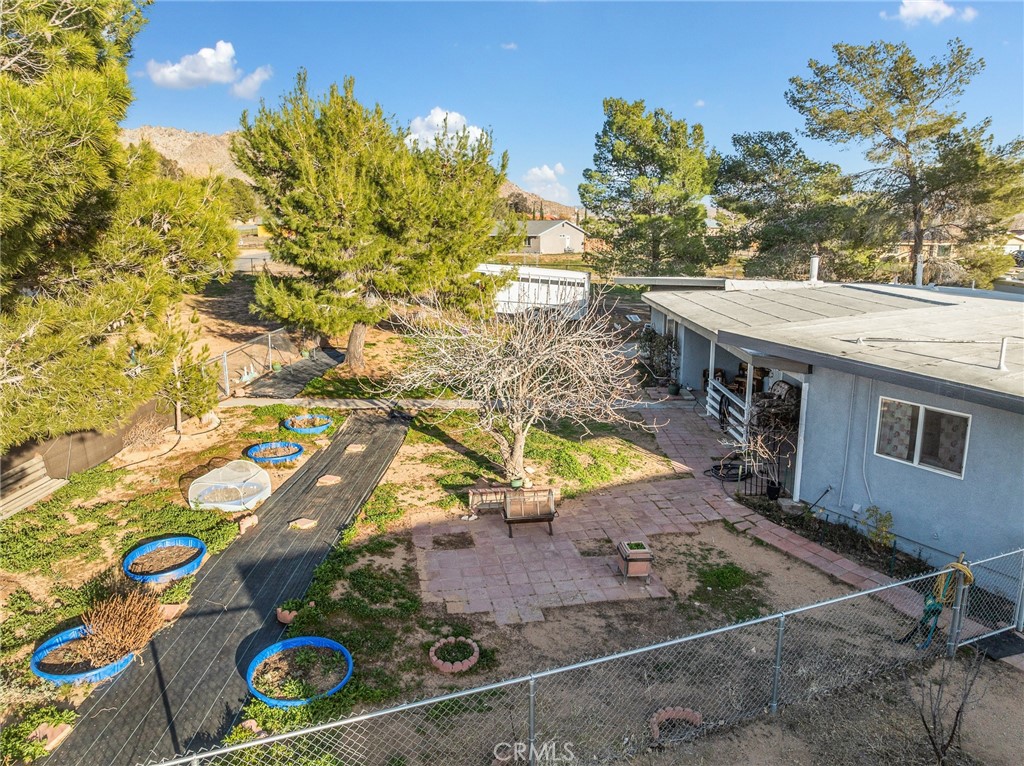 22977 El Centro Road Apple Valley, CA 92307 - Photo 25 of 30 view of a house with a backyard