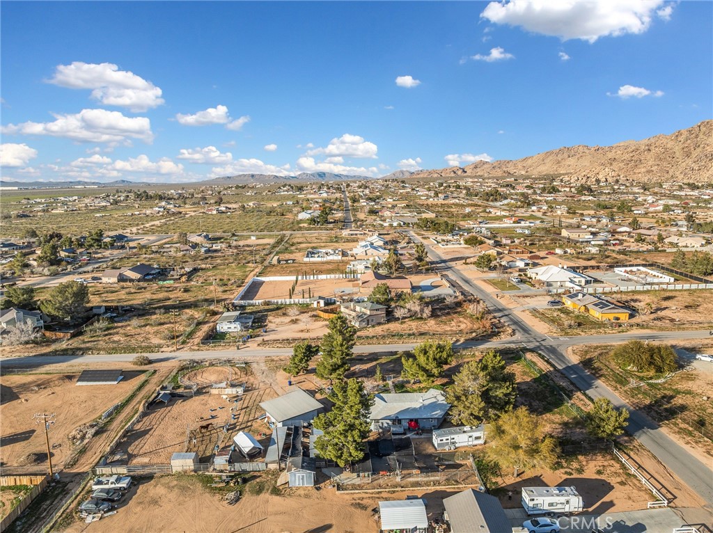 22977 El Centro Road Apple Valley, CA 92307 - Photo 7 of 30 an aerial view of residential building with green space