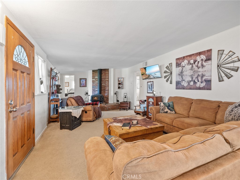 22977 El Centro Road Apple Valley, CA 92307 - Photo 10 of 30 a living room with furniture and a large window