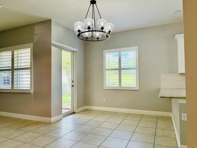 a view of an empty room with windows