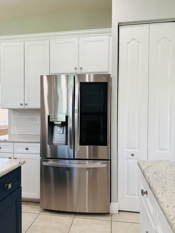 a spacious bathroom with a sink and a mirror