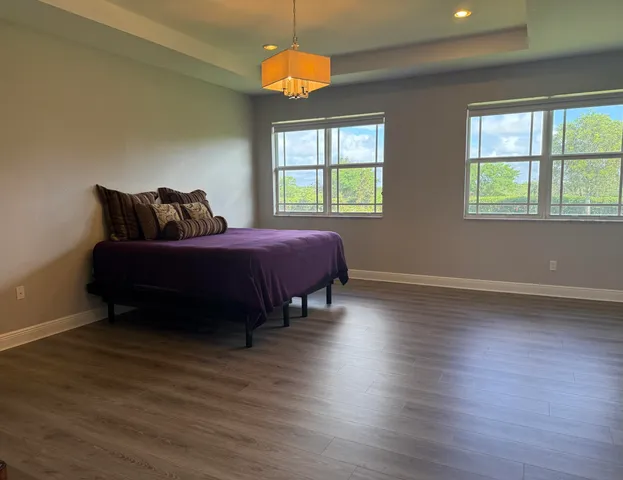 a bathroom with a sink vanity mirror and toilet