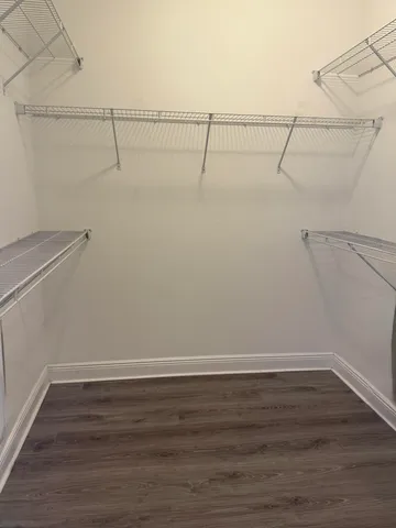 a bathroom with a sink vanity mirror and toilet