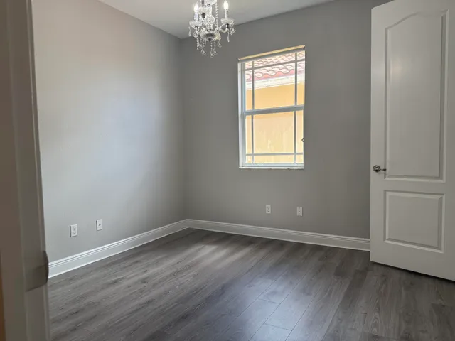a view of a chairs and tables in the patio