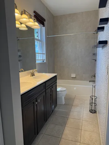 a view of a swimming pool with a table and chairs