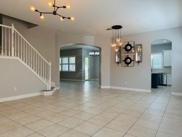 a view of a kitchen with a sink stainless steel appliances and cabinets