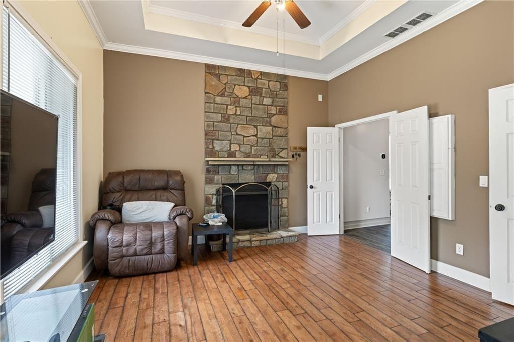 166 Freedom Lane Commerce, GA 30530 - Photo 18 of 25 a living room with furniture and a fireplace
