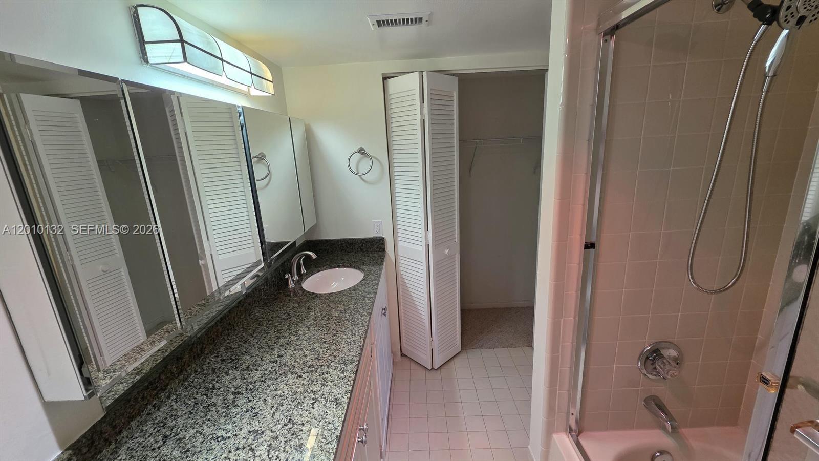 23305 Barwood Lane North, Unit 207 Boca Raton, FL 33428 - Photo 15 of 27 a bathroom with a shower