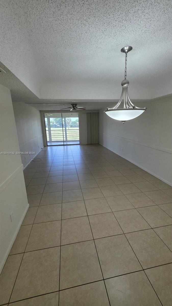 23305 Barwood Lane North, Unit 207 Boca Raton, FL 33428 - Photo 18 of 27 a view of a livingroom with a chandelier
