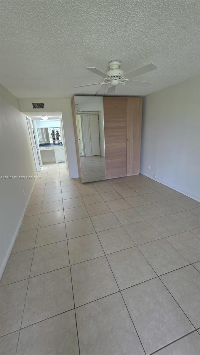 23305 Barwood Lane North, Unit 207 Boca Raton, FL 33428 - Photo 23 of 27 a view of an empty room with a kitchen