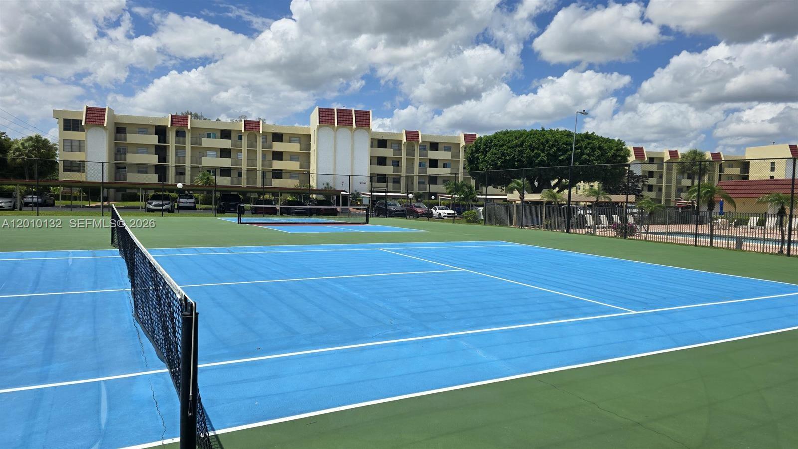 23305 Barwood Lane North, Unit 207 Boca Raton, FL 33428 - Photo 6 of 27 a view of a tennis court