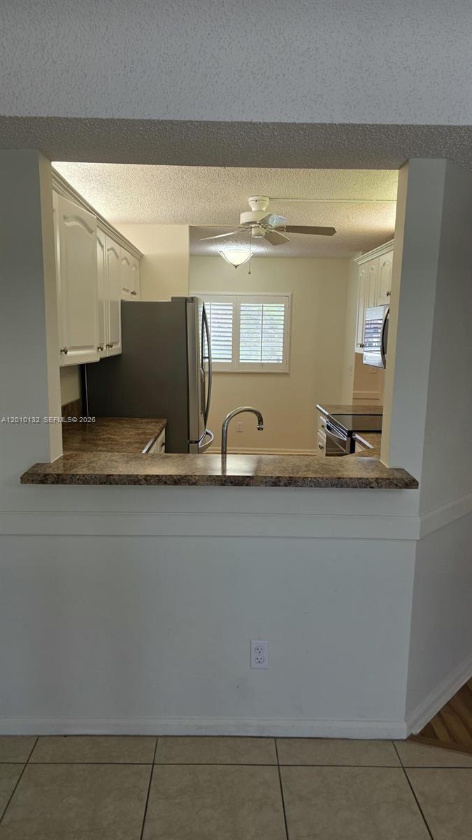 23305 Barwood Lane North, Unit 207 Boca Raton, FL 33428 - Photo 8 of 27 a close view of sink and mirror