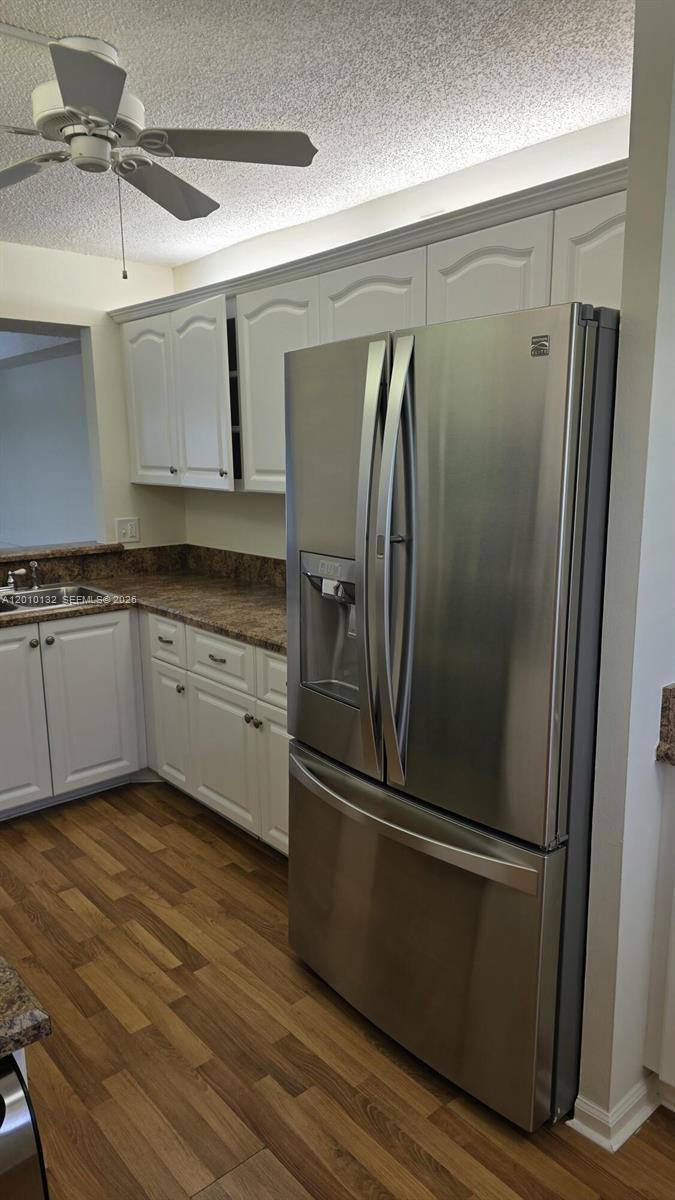 23305 Barwood Lane North, Unit 207 Boca Raton, FL 33428 - Photo 10 of 27 a kitchen with stainless steel appliances granite countertop a refrigerator and a sink