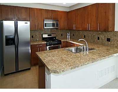829 Sylvan Lake Road, Unit 4 Eagle, CO 81631 - Photo 5 of 7 a kitchen with kitchen island a sink refrigerator and microwave
