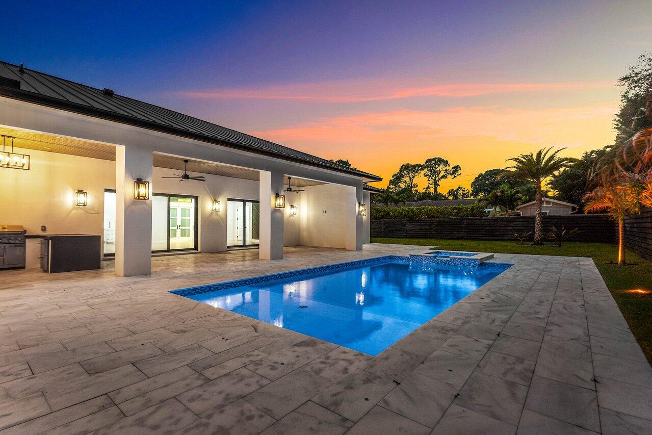 5701 Old Orange Road Jupiter, FL 33458 - Photo 17 of 46 a view of swimming pool with lounge chair