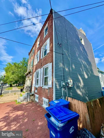 a view of a backyard with sitting area