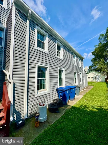 a kitchen with stainless steel appliances wooden cabinets and a stove top oven