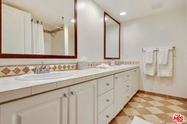 a close view of a utility room with washer and dryer