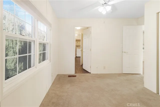 a view of an empty room with a window