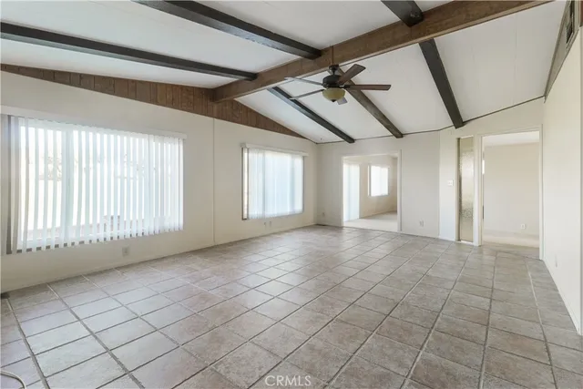 a view of an empty room with windows