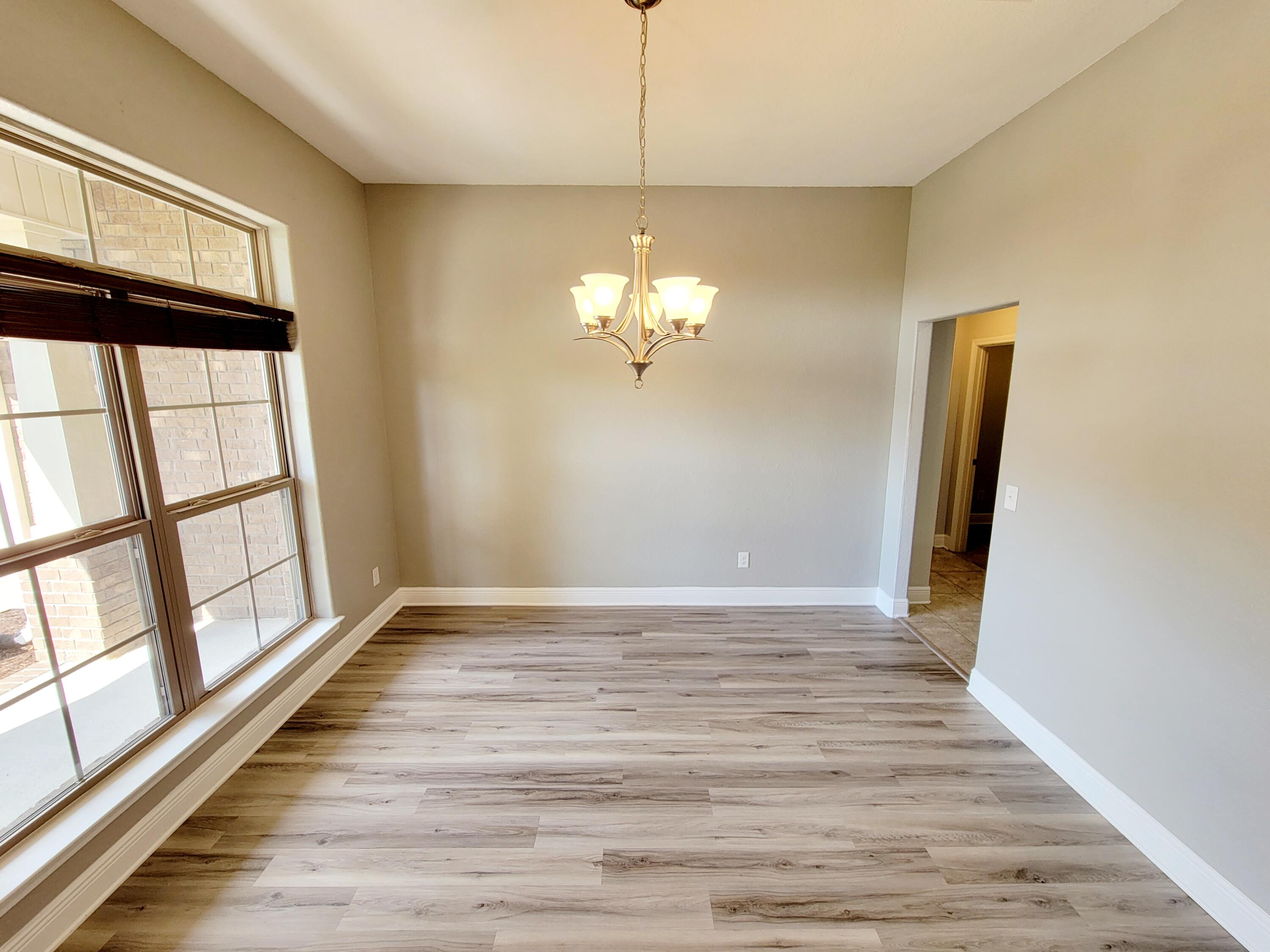 505 Vale Loop Crestview, FL 32536 - Photo 5 of 14 a view of a livingroom with wooden floor