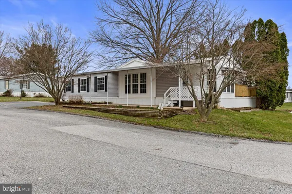 a house with trees in the background