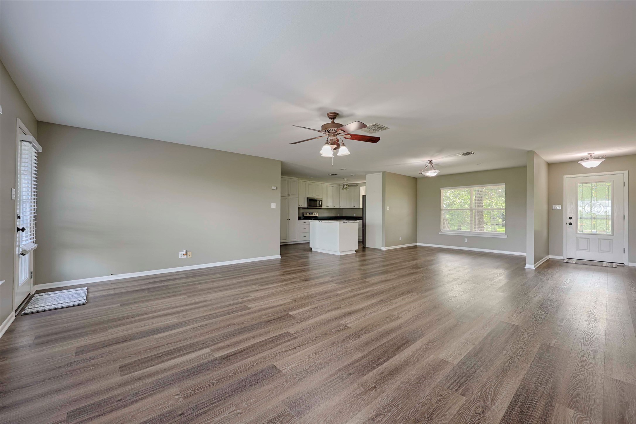 3545 East I- 10 Frontage Road Schulenburg, TX 78956 - Photo 16 of 40 a view of an empty room with window and wooden floor