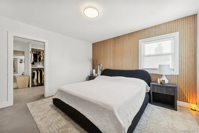 a bedroom with a bed and a cabinets