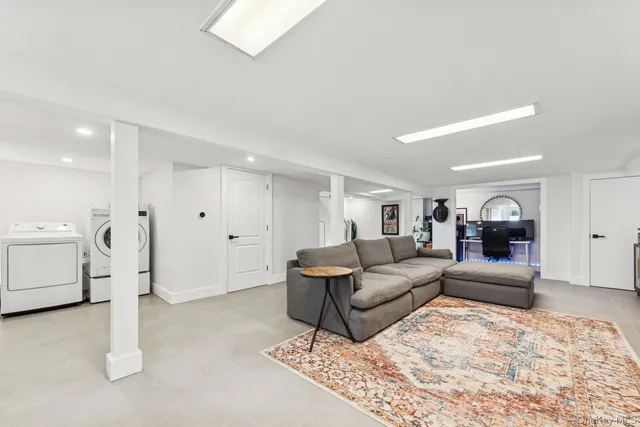 a living room with furniture and white walls