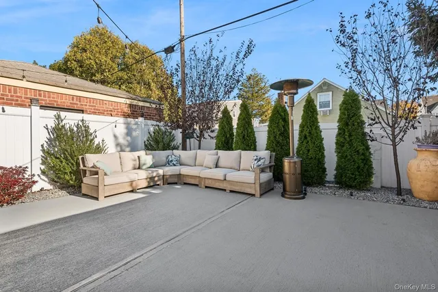 a view of a patio with couches and a fire pit
