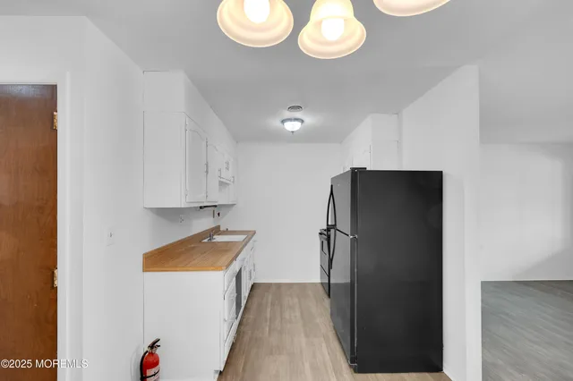 a kitchen with a refrigerator and a refrigerator