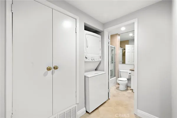 a bathroom with a toilet sink and a mirror