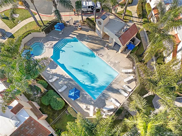 an aerial view of a house with a yard