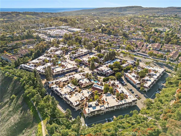 an aerial view of residential houses with outdoor space