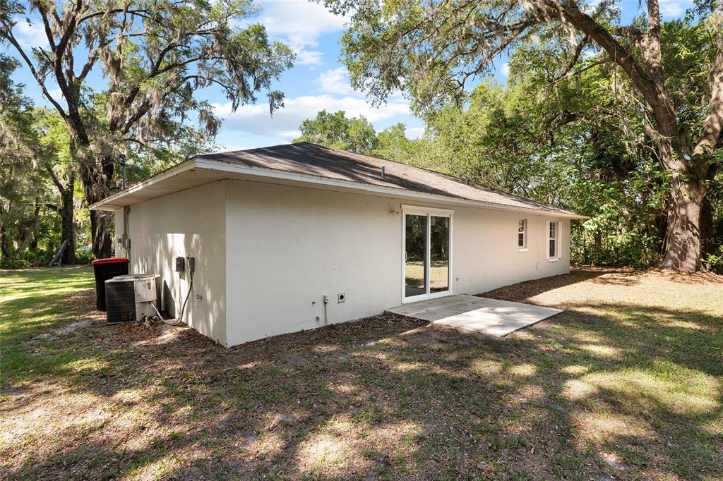 4329 Northwest 155th Street Reddick, FL 32686 - Photo 45 of 52 a house with trees in the background