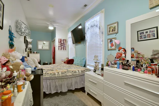 a bed room with a bed and a flat screen tv