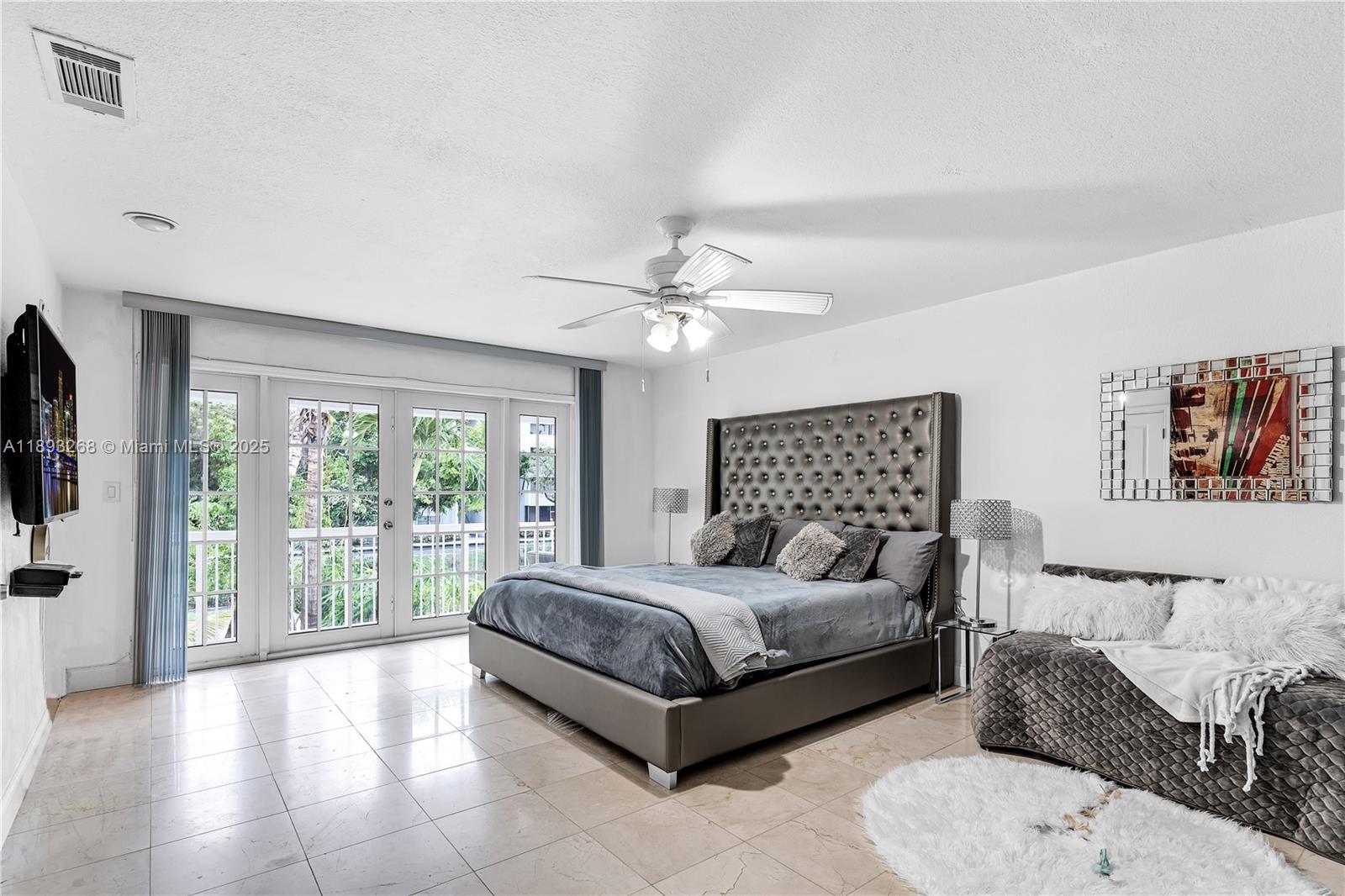 8909 Southwest 108th Circle Miami, FL 33176 - Photo 11 of 28 a living room with a couch and a large window