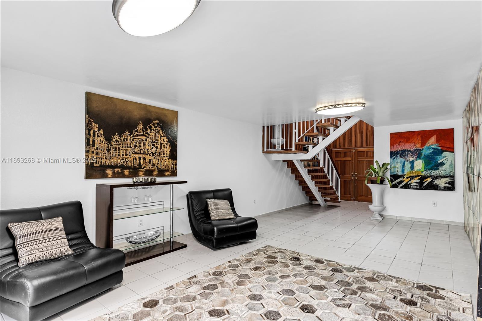 8909 Southwest 108th Circle Miami, FL 33176 - Photo 13 of 28 a living room with furniture and a flat screen tv