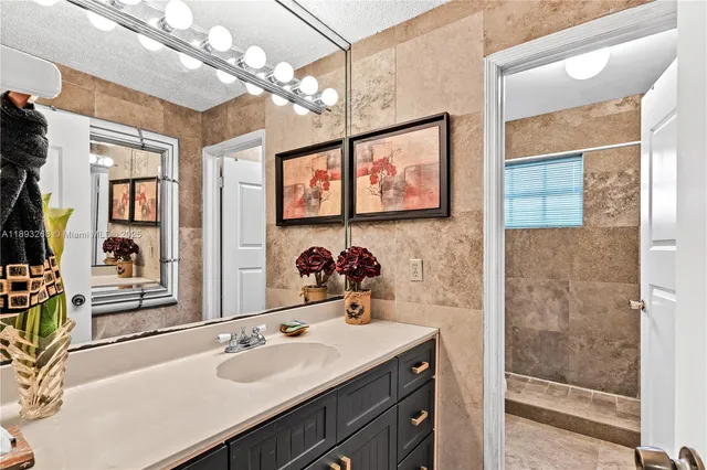 a bedroom with a large bed and a flat screen tv