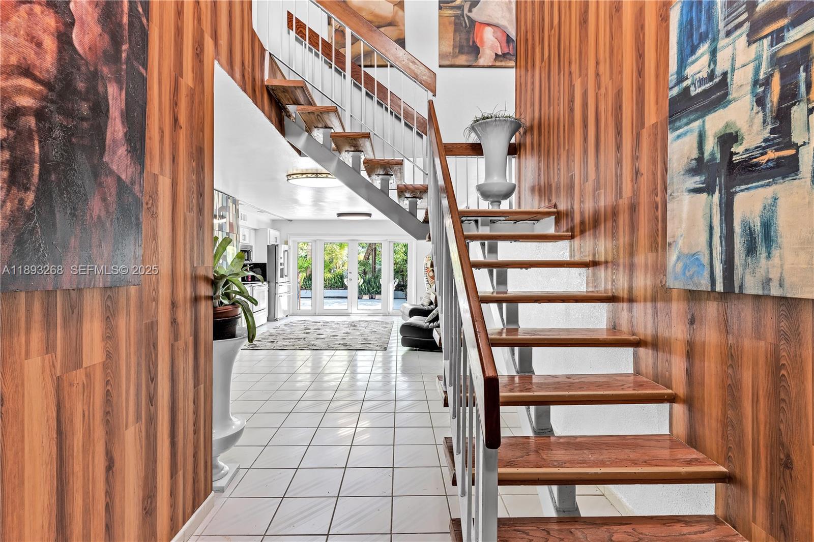 8909 Southwest 108th Circle Miami, FL 33176 - Photo 18 of 28 a view of staircase with large window