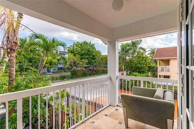 a view of balcony with furniture