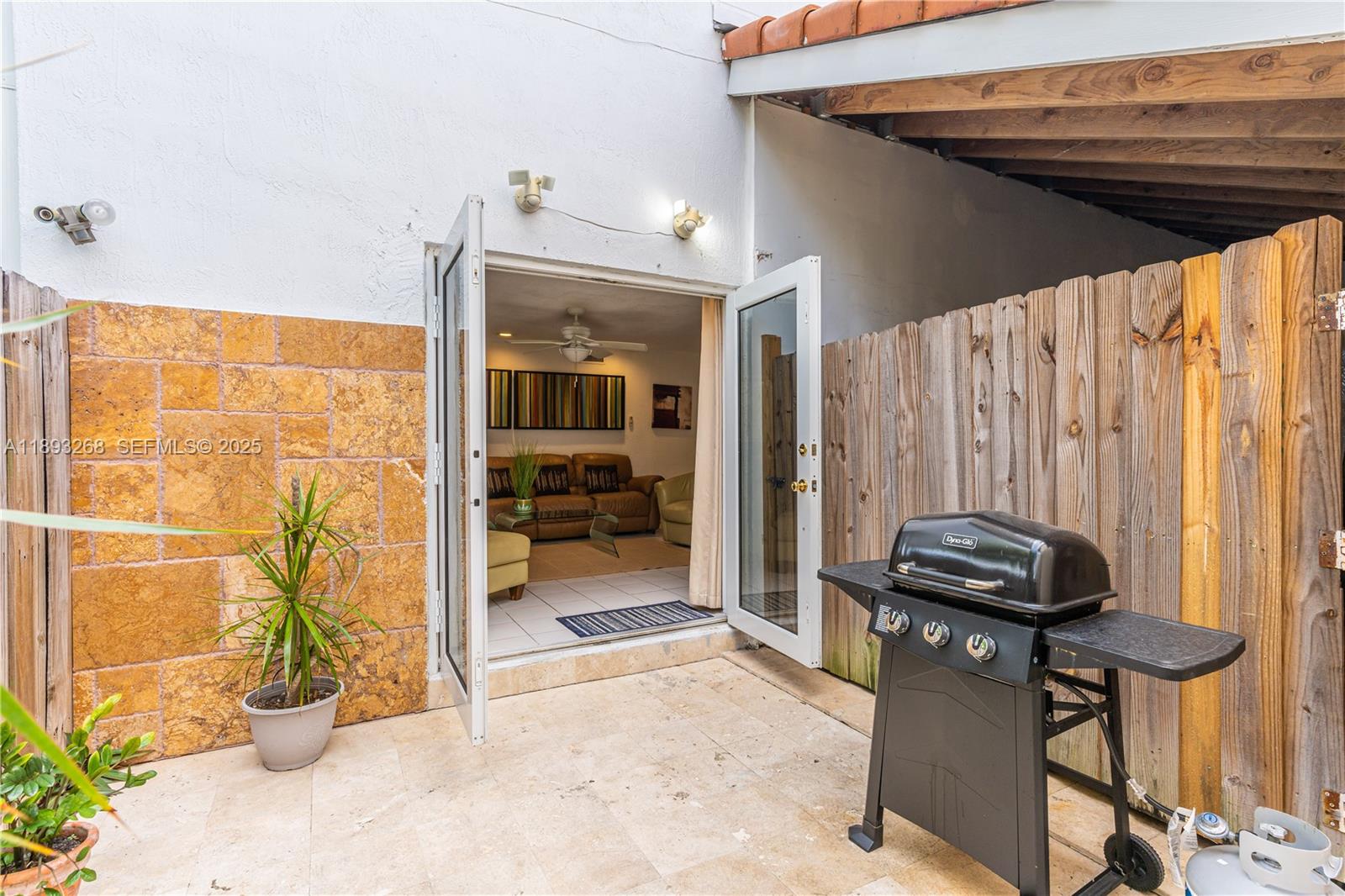 8909 Southwest 108th Circle Miami, FL 33176 - Photo 25 of 28 a view of a balcony with chair and front door