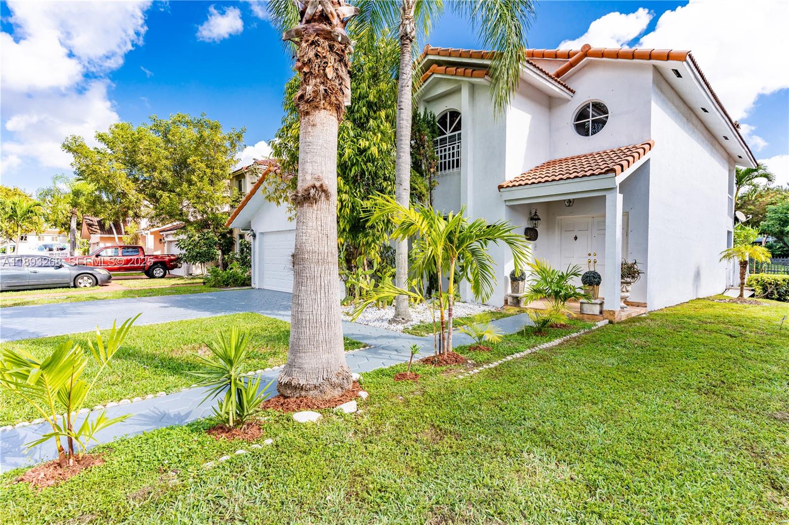 8909 Southwest 108th Circle Miami, FL 33176 - Photo 3 of 28 a front view of a house with a yard