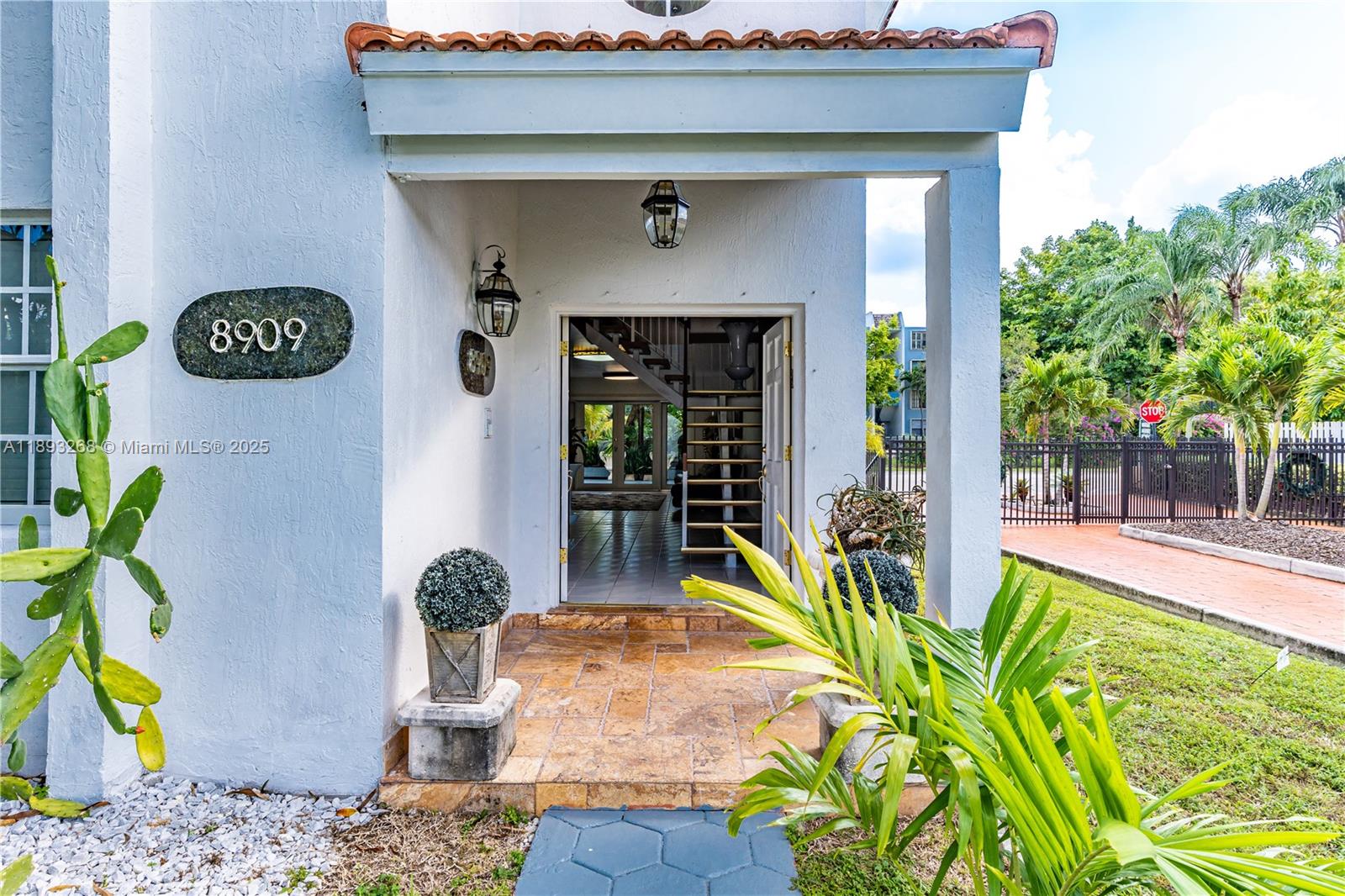 8909 Southwest 108th Circle Miami, FL 33176 - Photo 4 of 28 a front view of a house with garden