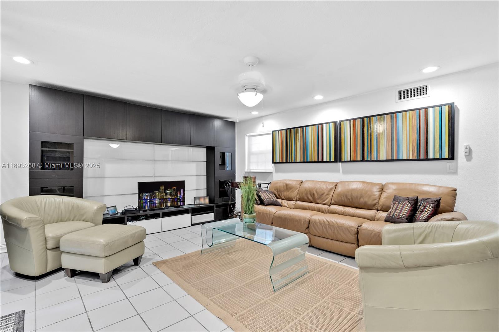 8909 Southwest 108th Circle Miami, FL 33176 - Photo 5 of 28 a living room with furniture and a fireplace