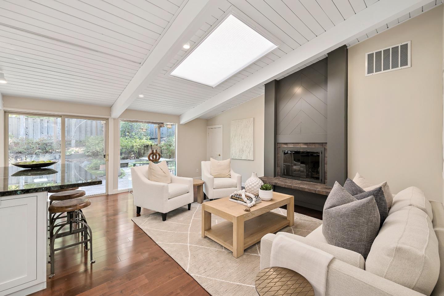 60 Linaria Way Portola Valley, CA 94028 - Photo 16 of 39 a living room with furniture fireplace and a large window
