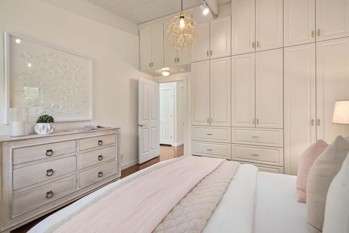 60 Linaria Way Portola Valley, CA 94028 - Photo 19 of 39 a spacious bedroom with a bed and a dresser
