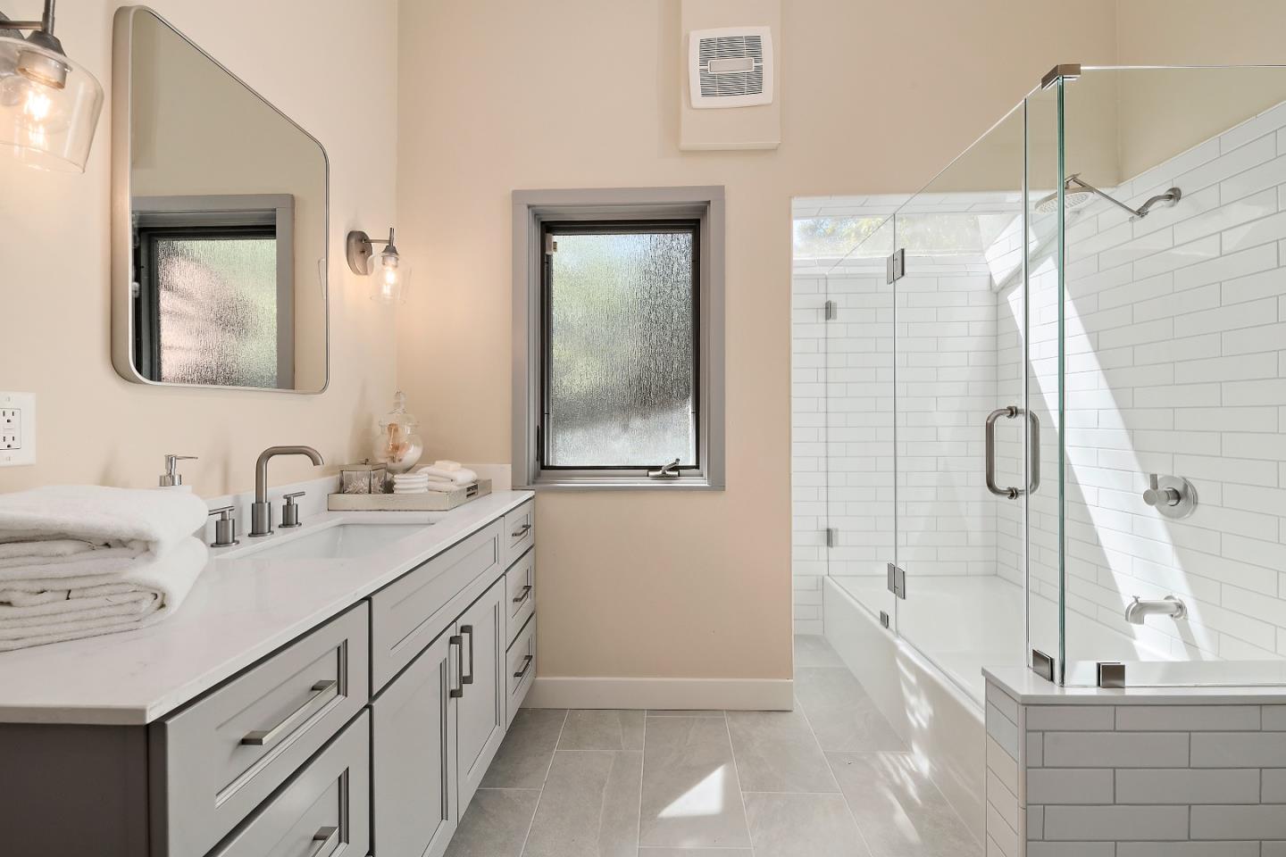 60 Linaria Way Portola Valley, CA 94028 - Photo 20 of 39 a bathroom with a granite countertop sink mirror and a shower