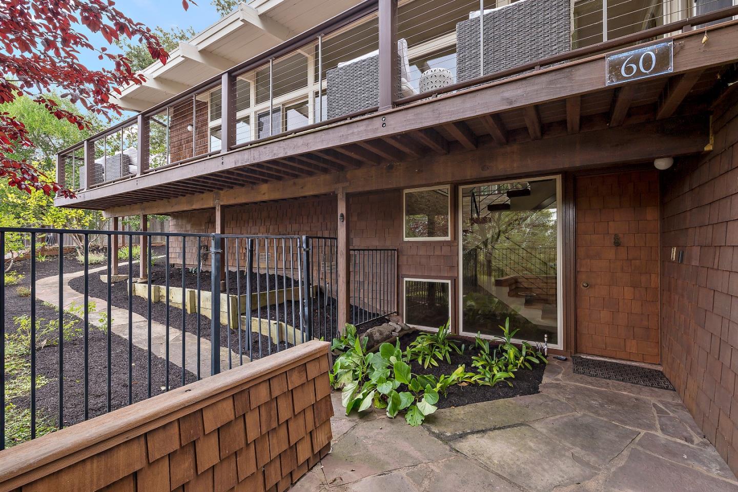 60 Linaria Way Portola Valley, CA 94028 - Photo 4 of 39 a view of a house with a small yard and wooden floor and fence